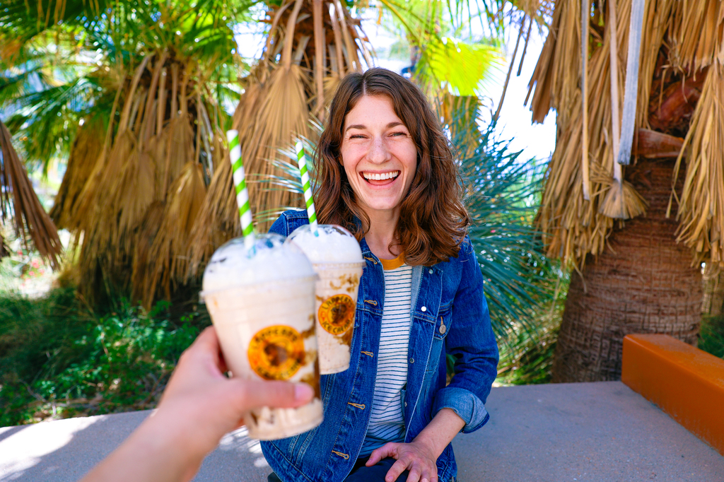 Getting a date shake is one of many unique things to do in Palm Springs, California! Woman holding a Lappert's Date Shake in Palm Springs.