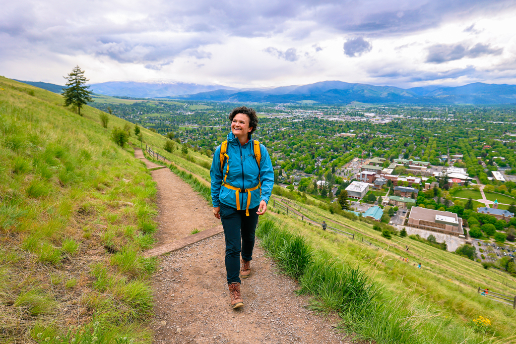Woman hiking along The M trail in Missoula, Montana of University of Montana campus