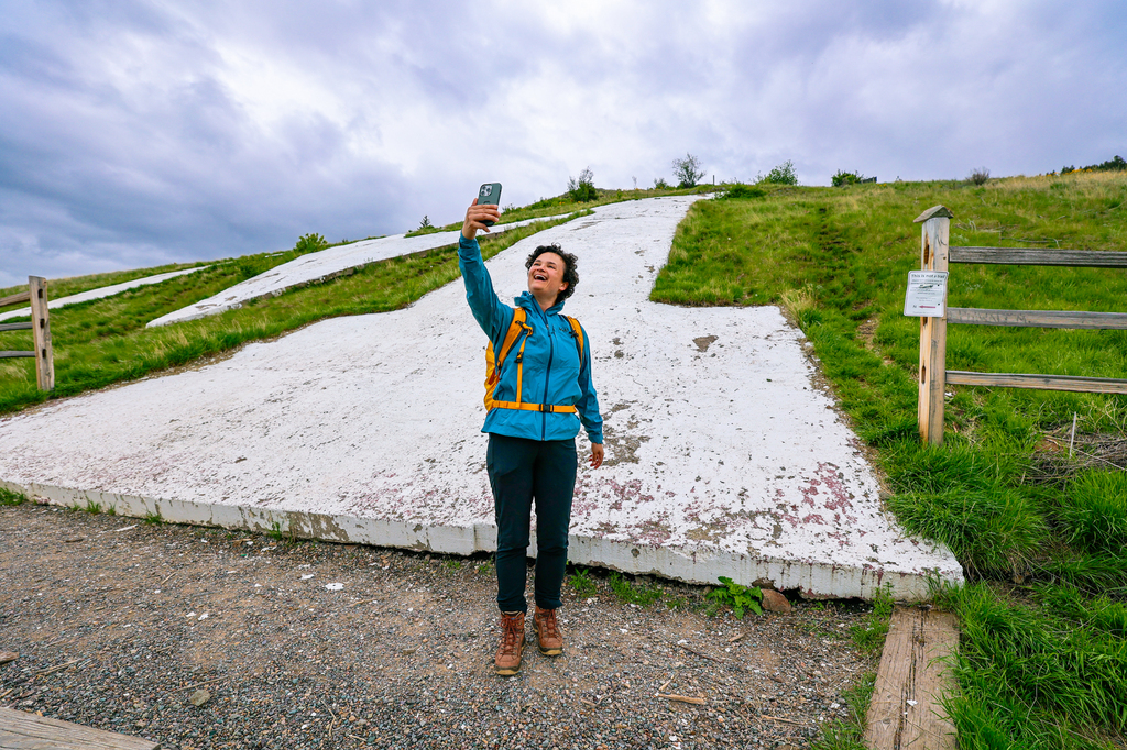 Woman taking a selfie along The M trail in Missoula, Montana of University of Montana campus