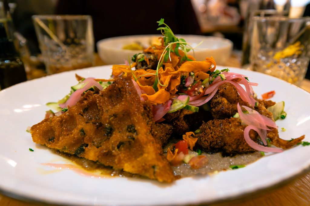 Enjoy an elevated dinner at Aurum Breckenridge lions mane chicken and waffles vegetarian dish 